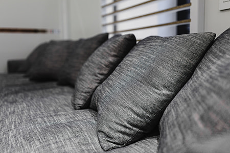 Beds with pillows on a designer exhibition thumbnail