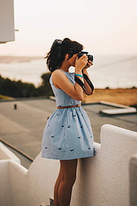 Woman Wearing Blue Sleeveless Dress thumbnail