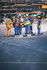 construction workers stands in front of construction site thumbnail
