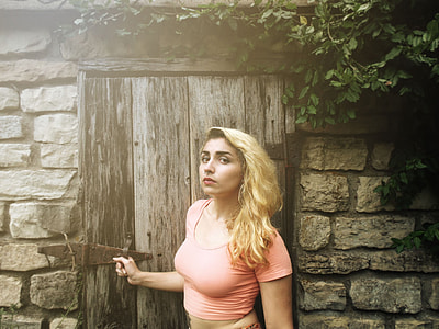 woman in pink crop top near door thumbnail