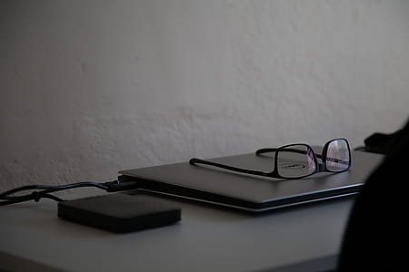 black framed eyeglasses on Dell laptop computer thumbnail