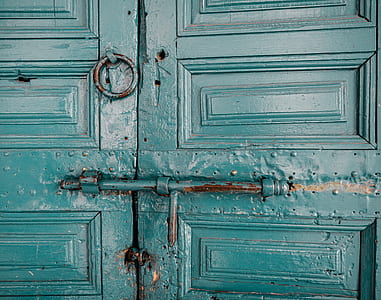 closed wooden door with metal bar lock thumbnail