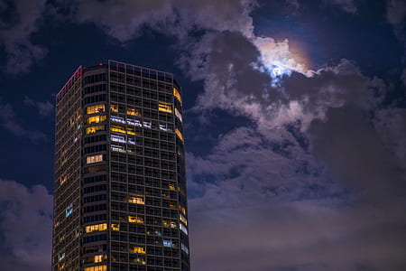 curtain building under blue sky and white clouds thumbnail