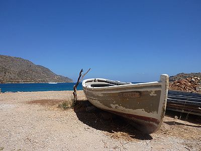 white and gray boat on shore during daytime thumbnail