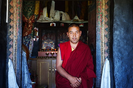 monk standing in front of door thumbnail