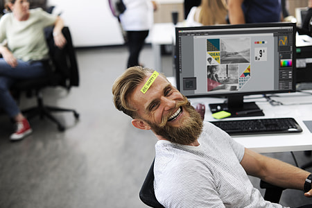 man in white crew-necks shirt leaning on mesh back rolling chair thumbnail