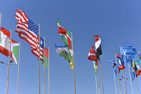 assorted flags under blue sky thumbnail