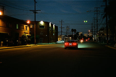 vehicle in roadway during nighttime thumbnail