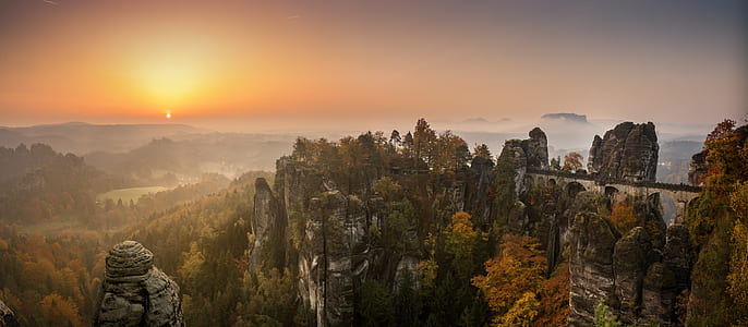 aerial photography of gray rock formation during sunset thumbnail