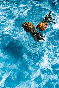 Pineapple in a swimming pool thumbnail