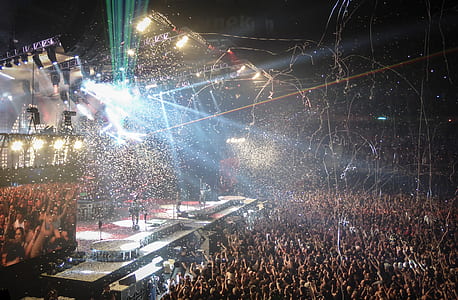 artists on top of stage in front of crowd thumbnail