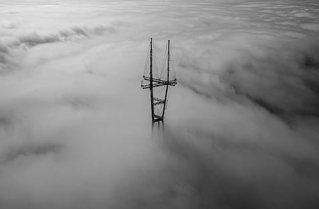 electric post surrounded with clouds thumbnail