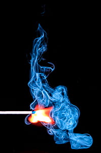 Lighted Match With Smoke on Black Background thumbnail