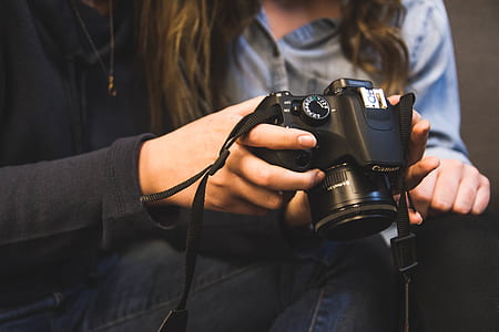 black Canon DSLR camera thumbnail