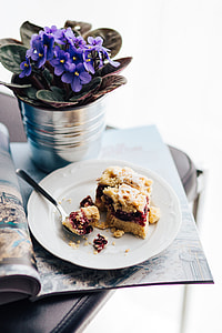Flowers in a pot with a cake and a book thumbnail