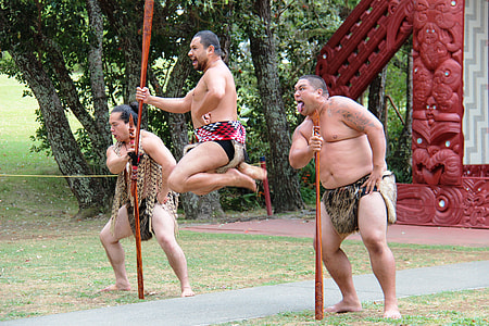 three men dancing on green lawn thumbnail
