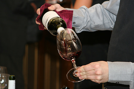 person pouring wine in goblet thumbnail