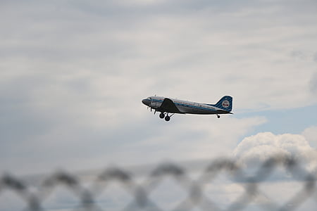 gray and white airline flying in sky during daytime thumbnail