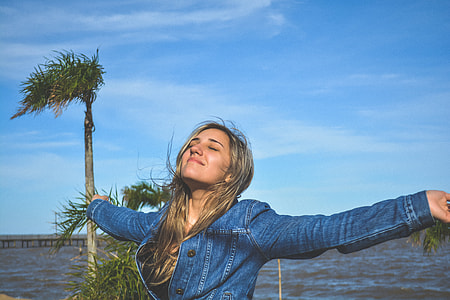 women's wearing blue button-up chambray jacket thumbnail