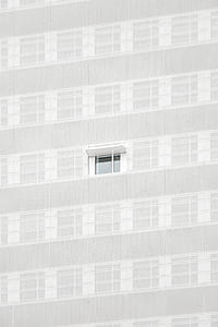 white building with one window opened thumbnail