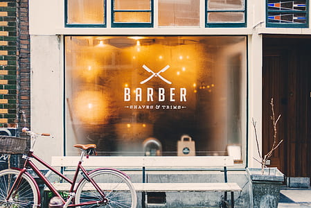 red bicycle beside barber shop thumbnail