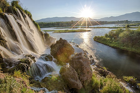 waterfalls near a lake thumbnail