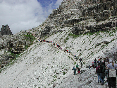 group of people climbing mountain thumbnail