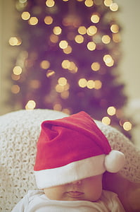 baby wearing red santa hat thumbnail