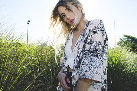 Woman Wearing White, Black, and Gray Floral Print Cardigan thumbnail