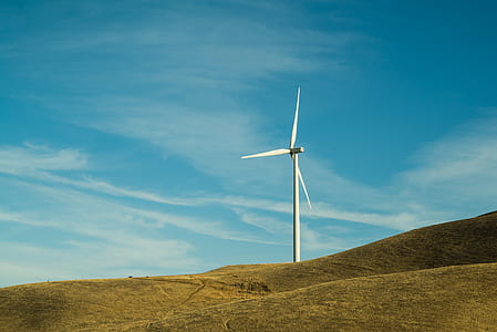 windmill on grass hill thumbnail