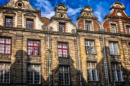 brown and beige building during daytime thumbnail