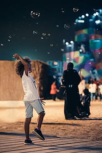 girl laying with bubbles during night thumbnail