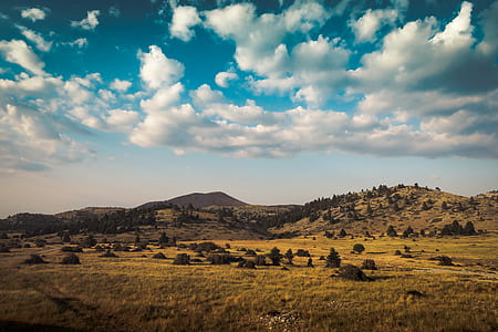 mountain under blue cloudy skies thumbnail