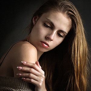 female wearing red lipstick touching her shoulder thumbnail