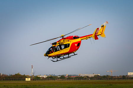red and yellow helicopter flying on air thumbnail