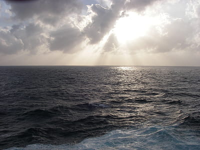 blue sea under cloudy sky thumbnail