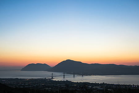 silhouette of buildings and sea thumbnail