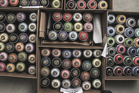 assorted-color spray paint cans in box thumbnail