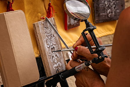 person painting on brown board thumbnail