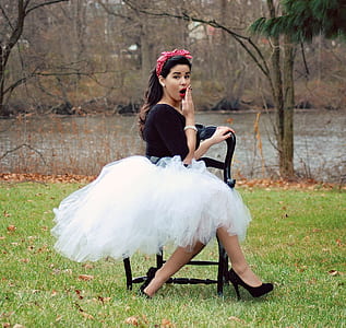 Woman Wearing Black And White Long Sleeve Dress thumbnail