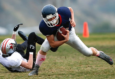 two men playing football thumbnail