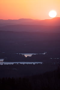 silhouette of trees near river during sunset thumbnail