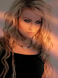 woman in black shirt and silver-colored necklace thumbnail
