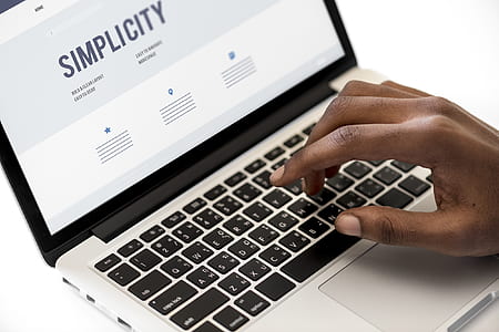 person using black and white laptop computer thumbnail