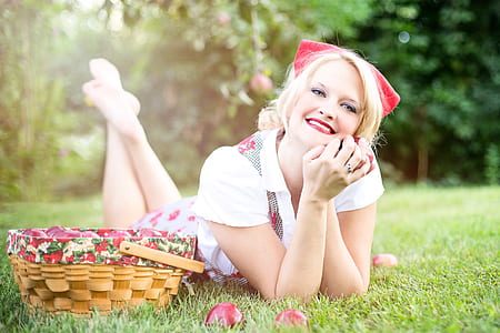 smiling woman wearing white collared shirt lying on ground thumbnail