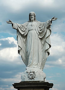 religious statue under blue sky and white clouds at daytime thumbnail