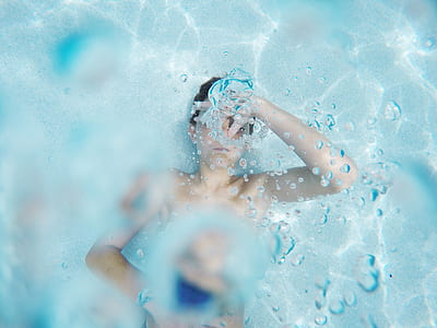 topless woman in body of water thumbnail