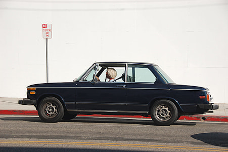 woman driving vehicle at daytime thumbnail