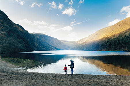 two person standing near water thumbnail