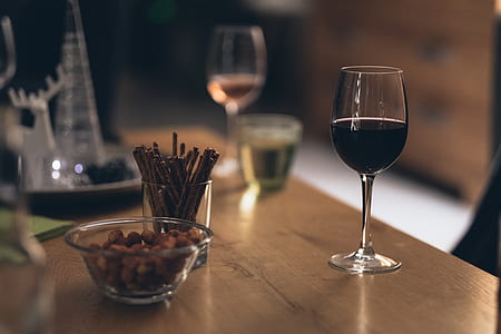 clear wine glass beside clear glass bowl thumbnail